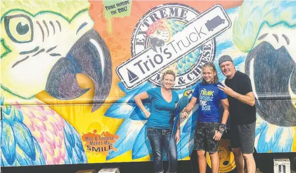  ??  ?? Krista, Cole and Brad Porter make up the crew of their 42-foot catamaran Saltair 3. During the summertime, they trade the sea for their endeavour, Trio’s Truck, from which they serve “extreme mac and cheese” back in the Lower Mainland.