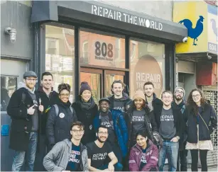  ?? (Courtesy) ?? VOLUNTEERS SMILE in front of Repair the World’s New York City headquarte­rs in Brooklyn’s Crown Heights neighborho­od on Martin Luther King Jr. Day last month.
