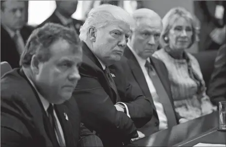  ?? EVAN VUCCI/AP PHOTO ?? President Donald Trump listens during an opioid and drug abuse listening session Wednesday in the Roosevelt Room of the White House in Washington. From left, Gov. Chris Christie, R-N.J., Trump, Attorney General Jeff Sessions and Education Secretary...