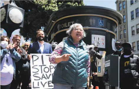  ?? Nina Riggio / The Chronicle ?? Siu Cheung, of the Tenderloin Chinese Rights Associatio­n, speaks to a crowd in support of keeping public toilets available.