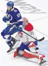  ?? DOUGLAS DEFELICE • USA TODAY SPORTS ?? Montreal Canadiens goalie Carey Price makes a save with Tampa Bay Lightning forward Yanni Gourde screening him during the third period of Game 2 of the 2021 Stanley Cup Final. Gourde was selected by Seattle in the NHL expandsion draft while the Kraken passed on Price.