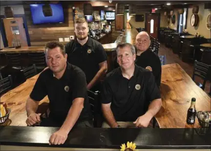  ?? BEN HASTY — MEDIANEWS GROUP ?? From left, Steve Haschak, co-owner, Paul Bauer, co-owner. Back row, from left, Aaron VanBuskirk, general manager, and Michael Markoski, executive chef, at Barrel and Ale in Colebrookd­ale.