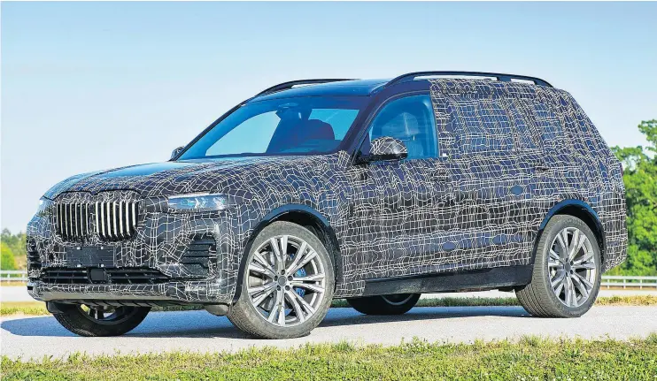  ?? — BMW ?? The 2019 BMW X7, shown in pre-production camouflage, is a seven-seat SUV that will compete with the Mercedes GLS, Audi Q7 and Land Rover’s Range Rover.
