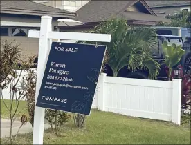  ?? The Maui News / MELISSA TANJI photo ?? A for sale sign hangs outside a Kahului home Sunday. Median sales price for a single family home in December was $1.08 million.