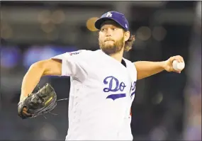  ?? Mark J. Terrill / Associated Press ?? The Dodgers and three-time Cy Young Award winner Clayton Kershaw reached an agreement on a contract extension Friday that will keep the seven-time All-Star with the club through 2021.