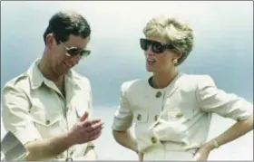  ?? DAVE CAULKIN — THE ASSOCIATED PRESS FILE ?? Britain’s Prince Charles and Princess Diana, laugh together during their 1991 visit to an iron ore mine near Carajas, Brazil. Producers of a new documentar­y about Princess Diana say it offers insight. Critics say it’s nothing but exploitati­on.