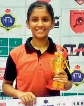 ??  ?? Akula Sreeja poses with the winner’s trophy.