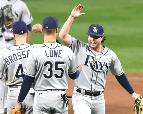  ?? Ap ?? WITHIN THEIR REACH: After Tampa Bay’s 2-1 win against Baltimore last night, the Rays’ magic number to clinch the AL East is down to 5.