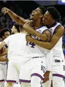  ?? Jamie Squire / Getty Images ?? Malik Newman, left, scored a careerhigh 32 and all 13 of the Jayhawks’ points in overtime.