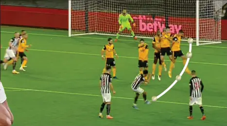  ??  ?? Mind the gap: Murphy spots the opening and bends the free-kick round the Wolves defensive wall