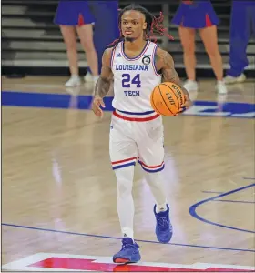  ?? Sadie Patton/Louisiana Tech Sports Informatio­n ?? In the backcourt: Louisiana Tech’s Cobe Williams brings the ball up the floor during a game earlier this season in Ruston, La. The Bulldogs play at Charlotte tonight. In women’s basketball, Louisiana Tech hosts Charlotte looking to extend its winning streak to five straight games. The Lady Techsters have also won six of their last seven games.