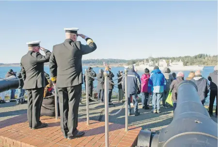  ?? LEADING SEAMAN DAVID GARIEPY, 2019 DEPARTMENT OF NATIONAL DEFENCE ?? Formation Chief Petty Officer 1st Class David Steeves, left, and Maritime Forces Pacific commander Rear Admiral Bob Auchterlon­ie receive a salute from the crew of HMCS Regina as the navy ship passes Duntze Head after leaving CFB Esquimalt on Wednesday.