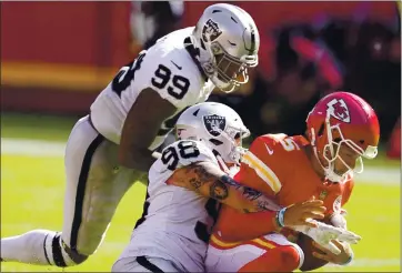  ?? CHARLIE RIEDEL — THE ASSOCIATED PRESS ?? The Raiders’ Maxx Crosby (98) sacks Chiefs quarterbac­k Patrick Mahomes during the second half of Sunday’s game.