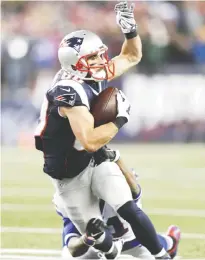  ??  ?? FOXBOROUGH: Buffalo Bills safety Leodis McKelvin, back, tackles New England Patriots wide receiver Danny Amendola (80) after a catch in the first half of an NFL football game Monday, in Foxborough, Mass. — AP