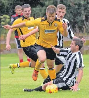  ?? Photos: Alba Photos. ?? Fort William’s Daniel Highet jumps over this tackle from Fraserburg­h’s Michael Rae.