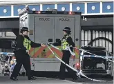  ??  ?? Danger: Police secure the scene near Waterloo railway station in London.