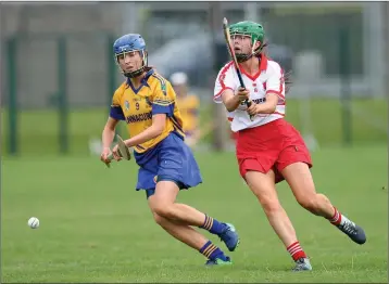  ??  ?? Annacurra’s Niamh Shannon reaches the ball ahead of Aughrim’s Emma Murphy.