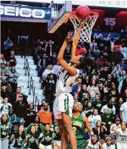  ?? Christian Abraham/Hearst Connecticu­t Media ?? Norwalk’s Naeva Rene sends the winning shot into the basket to beat New London for the 2019 Class LL state championsh­ip at Mohegan Sun Arena.