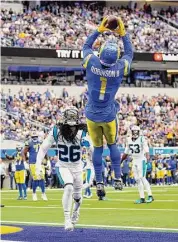  ?? Ashley Landis/Associated Press ?? Los Angeles Rams wide receiver Allen Robinson II makes a touchdown catch over Carolina Panthers cornerback Donte Jackson during the first half on Oct. 16 in Inglewood, Calif.