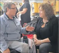  ?? ASHLEY FITZPATRIC­K/THE TELEGRAM ?? Joanne Macdonald (left) speaks with Servicenl Minister Sherry Gambinwals­h about new accessibil­ity regulation­s following an announceme­nt at the Empower building on Escasoni Place in St. John’s on Monday.