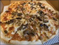  ?? (Arkansas Democrat-Gazette/Eric E. Harrison) ?? Consistenc­y is a constant at U.S. Pizza, including their headquarte­rs location in Hillcrest, and including this medium sausage and mushroom pizza.