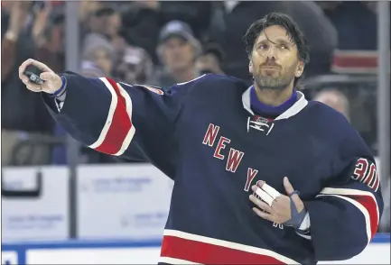  ?? ADAM HUNGER -— ASSOCIATED PRESS FILE ?? In a Feb. 11, 2017, photo, New York Rangers goalie Henrik Lundqvist celebrates his 400th career win after the team’s 4-2win over the Colorado Avalanche at Madison Square Garden in New York.
