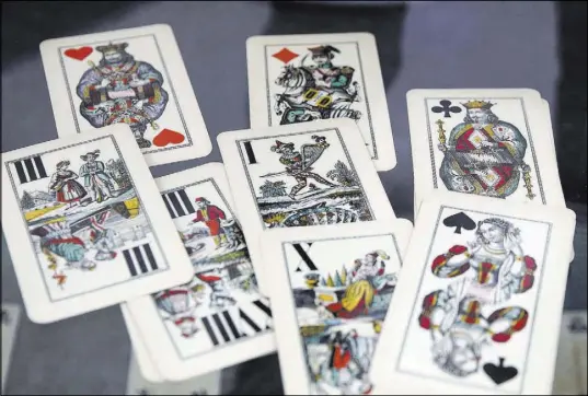  ?? Bizuayehu Tesfaye Las Vegas Review-Journal @bizutesfay­e ?? Playing cards from the 1900s on display at the 50th anniversar­y exhibit at Lied Library