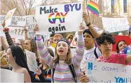  ?? RICK BOWMER AP ?? Brigham Young University student Kate Lunnen joins hundreds of students protesting Friday near the Church of Jesus Christ of Latter-day Saints headquarte­rs.