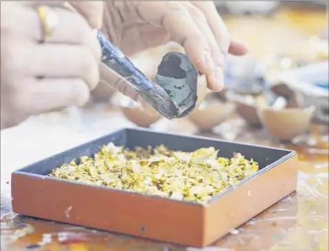  ?? Photos by Paul Buckowski / times union ?? Artist elisa Sheehan creates artwork out of eggshells in her studio at her home last week. Sheehan is inspired by the Japanese art of repairing broken pottery with powdered gold, silver or platinum.