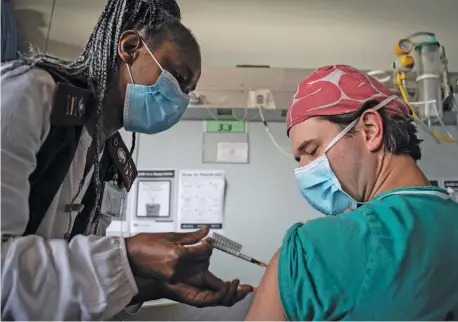  ?? Picture: Jacques Nelles ?? A LITTLE STING. An emergency room doctor at the Steve Biko Academic Hospital in Pretoria gets his injection of the Johnson & Johnson Covid-19 vaccine.