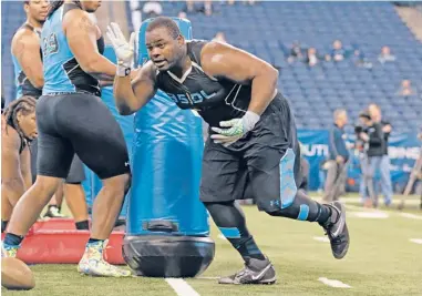  ?? | AP ?? Notre Dame defensive tackle Louis Nix III, who had knee surgery in November, works out at the NFL Scouting Combine.