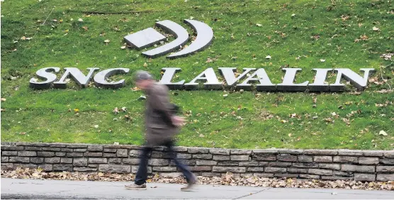  ?? PAUL CHIASSON/THE CANADIAN PRESS FILES ?? SNC-Lavalin says it has reached “final and fair” settlement­s with Montreal, Quebec, Laval, Levis, Longueuil, Deux-Montagnes and the municipali­ty of Saint-Cyprien to repay funds tied to public contracts it won due to fraud or fraudulent tactics. The...