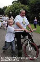  ??  ?? Dan McCarthy Killarney gets a push from his grandson Patrick Daly