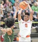  ?? Scott Herpst ?? Lafayette’s Decameron Porter gets set to launch a shot over an Adairsvill­e defender during last week’s game. The senior had 24 points and 14 rebounds to help the Ramblers to the home victory.