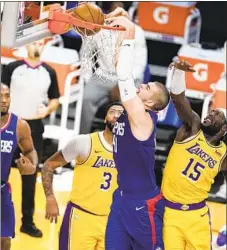  ?? Marcio Jose Sanchez Associated Press ?? CLIPPERS center Ivica Zubac, dunking, should start even when Serge Ibaka returns to the lineup, a Western Conference scout says.