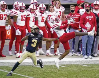  ?? MICHAEL CONROY / ASSOCIATED PRESS ?? Nebraska cornerback Cam Taylor-Britt breaks up a pass intended for Purdue wide receiver David Bell in the fourth quarter of a Big Ten game last December. The Bengals drafted Taylor-Britt in the second round. The Browns took Bell in the third.