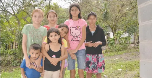  ??  ?? Pictured are some of the kids who benefitted from Amos’ last school-building trip to Horconcito­s, Honduras. She’s returning to the same city in January to help build a science lab at another school.