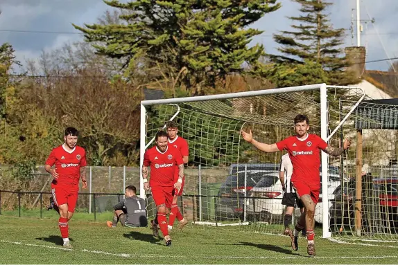  ?? Nathan Bennett ?? »Celebratio­ns for Barnstaple in their 4-0 home win against Millbrook in the the Western League. Results, tables and fixtures – Page 47