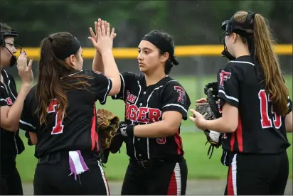  ?? Photos by Jerry Silberman / risportsph­oto.com ?? The Tolman softball team suffered a 10-0 five-inning Division I defeat to red-hot Coventry Tuesday afternoon. Tolman starting pitcher Hannah Coken (right) pitched into the fourth inning. The Tigers face Cranston East to end the season tomorrow at...