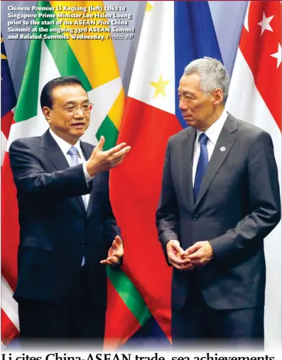  ?? Photo: AP ?? Chinese Premier Li Keqiang (left) talks to Singapore Prime Minister Lee Hsien Loong prior to the start of the ASEAN Plus China Summit at the ongoing 33rd ASEAN Summit and Related Summits Wednesday.