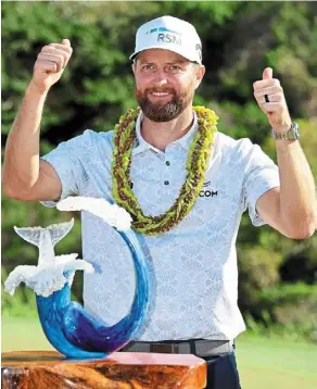  ?? — AFP ?? Thumbs-up: Chris Kirk posing with the trophy after winning the sentry at the Kapalua Golf Club in Hawaii on sunday.