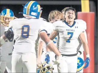  ?? DOUG DURAN — STAFF PHOTOGRAPH­ER ?? Foothill High’s Noah Lombardi celebrates with teammates after the Falcons defeated Dublin 24-10 on Friday.