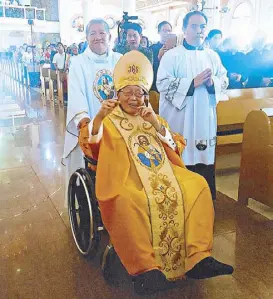  ??  ?? Bishop Jesus Varela (seated) with Fr. Gerard Deveza and Fr. RJ Piñero.