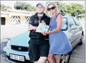  ?? PICTURE: SIYANDA MAYEZA ?? EERIE: Helen Ziegler and her son Mark hold an e-toll fine – but their car hasn’t been outside KwaZulu-Natal.