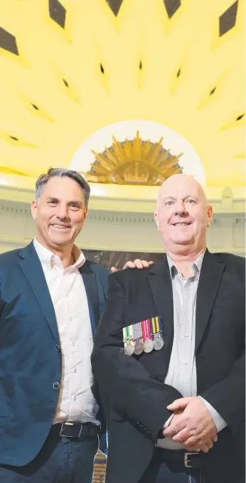  ?? Picture: PETER RISTEVSKI ?? Chris Young (right), who served in Malaysia as a peacekeepe­r, has received a certificat­e for his service from Corio MP Richard Marles.