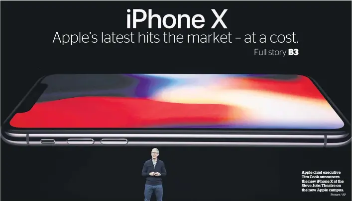  ?? Picture / AP ?? Apple chief executive Tim Cook announces the new iPhone X at the Steve Jobs Theatre on the new Apple campus.