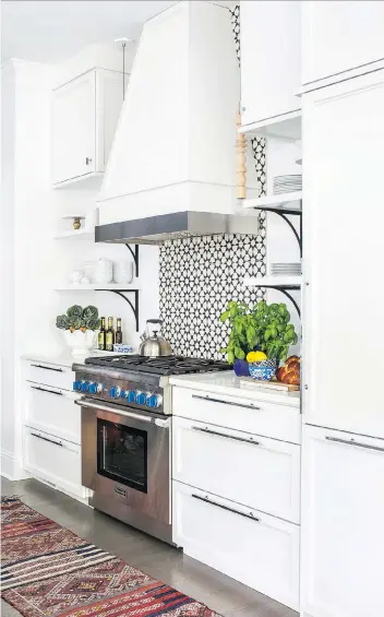  ?? TERRACOTTA DESIGN ?? Sure, drawers are great for utensils and towels, but these days kitchen designers are incorporat­ing deeper versions that are perfect for storing larger dishes and small appliances.