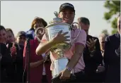  ?? ERIC GAY — THE ASSOCIATED PRESS ?? Justin Thomas holds the Wanamaker Trophy after he won the PGA Championsh­ip in a playoff against Will Zalatoris at Southern Hills Country Club on Sunday in Tulsa, Okla.