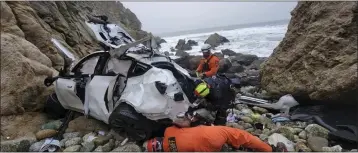  ?? SGT. BRIAN MOORE — SAN MATEO COUNTY SHERIFF’S OFFICE VIA AP ?? Emergency personnel respond to a vehicle over the side of Highway 1on Jan. 2in San Mateo County. A Tesla driver accused of trying to kill his wife and two young children by driving off a Northern California cliff has pleaded not guilty to attempted murder and domestic violence. A judge ordered Pasadena resident Dr. Dharmesh Patel held without bail at a hearing Thursday.