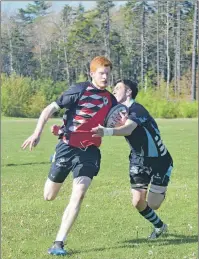  ?? THE NEWS ?? Reed MacDonald of the NRHS Nighthawks gets hauled down by NNEC Gryphons defender Bailey Fraser in a game this week.